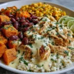 White Chicken Chili Burrito Bowls with Roasted Sweet Potatoes and Queso Drizzle